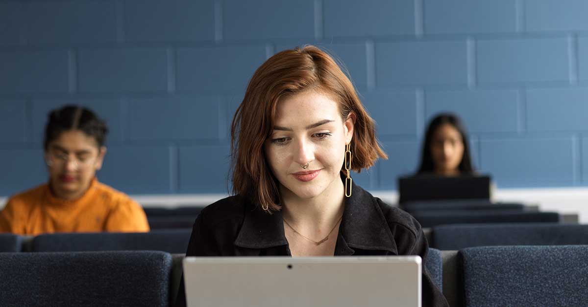 UCLan student working on laptop